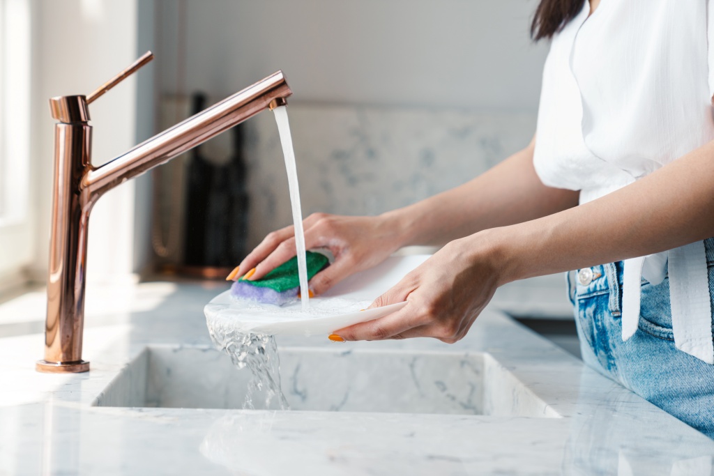 young woman at home washing the 1 1